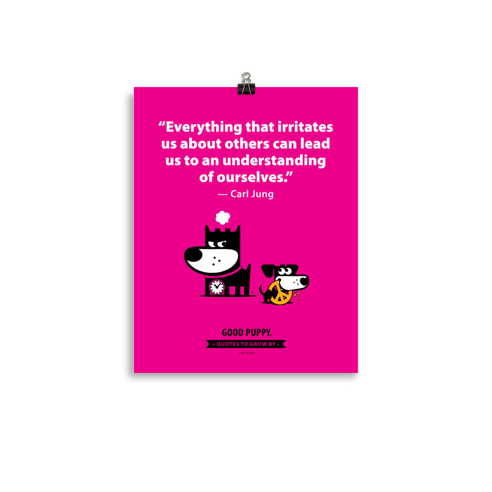 The image has a pink background with a quote from Carl Jung: "Everything that irritates us about others can lead us to an understanding of ourselves." Below the text, there is an illustration of a black and white dog with a clock collar, looking irritated, and a smaller black and white dog holding a peace symbol in its mouth. At the bottom, it reads "GOOD PUPPY. Quotes to Grow By."