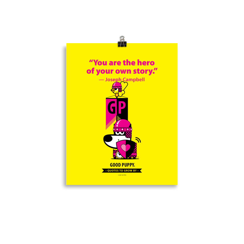 The image features a yellow background with pink text that reads, "You are the hero of your own story." — Joseph Campbell. Below the quote, there is an illustration of a dog in pink armor with a heart on its shield and a clock around its neck. The dog is standing next to a block with the letters "GP" and a bird perched on top. At the bottom, it says "GOOD PUPPY. Quotes to Grow By."
