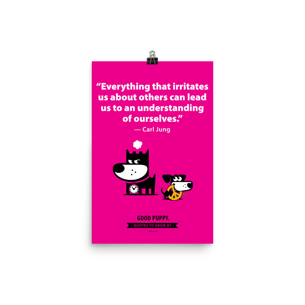 The image has a pink background with a quote from Carl Jung: "Everything that irritates us about others can lead us to an understanding of ourselves." Below the text, there is an illustration of a black and white dog with a clock collar, looking irritated, and a smaller black and white dog holding a peace symbol in its mouth. At the bottom, it reads "GOOD PUPPY. Quotes to Grow By."
