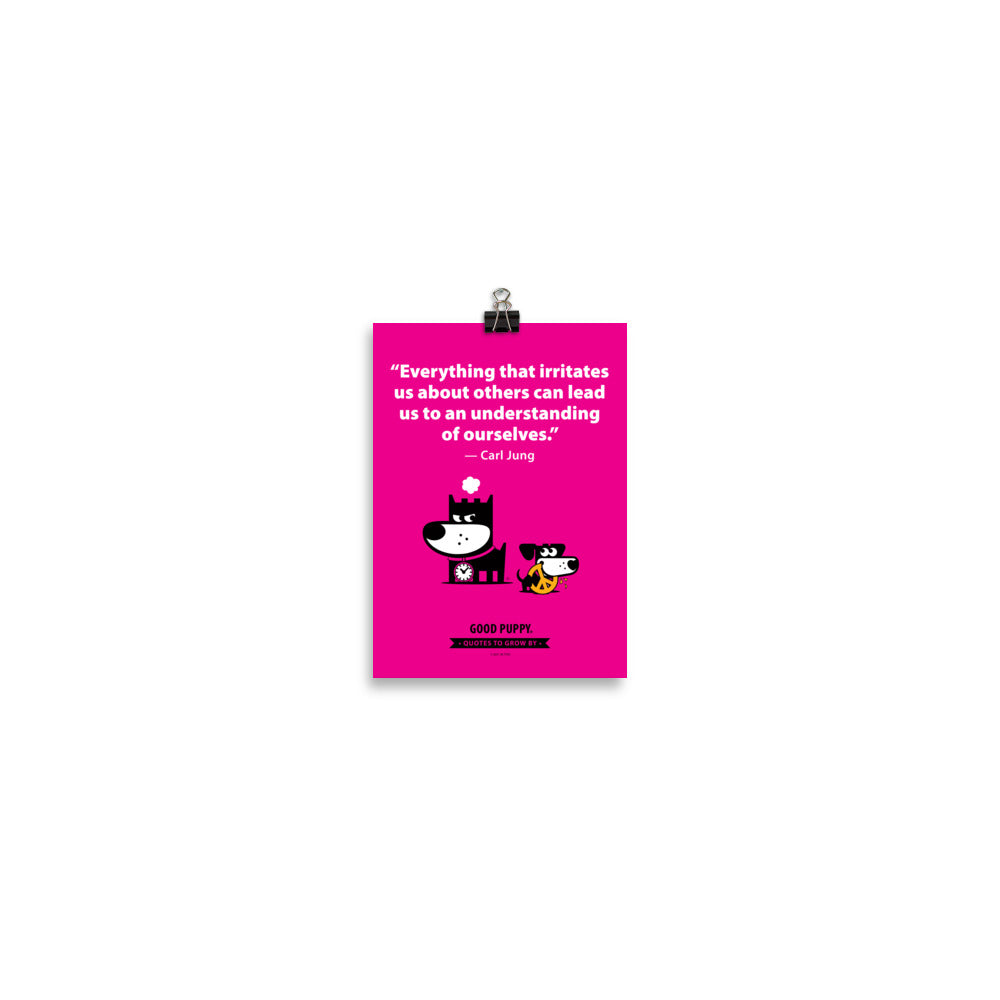 The image has a pink background with a quote from Carl Jung: "Everything that irritates us about others can lead us to an understanding of ourselves." Below the text, there is an illustration of a black and white dog with a clock collar, looking irritated, and a smaller black and white dog holding a peace symbol in its mouth. At the bottom, it reads "GOOD PUPPY. Quotes to Grow By."