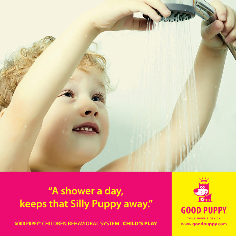 A young child stands under a shower, adjusting the showerhead. Below the image, the text reads: "A shower a day, keeps that Silly Puppy away." This is part of the Good Puppy Children Behavioral System, labeled "Child’s Play," with the Good Puppy logo and website link at the bottom right.