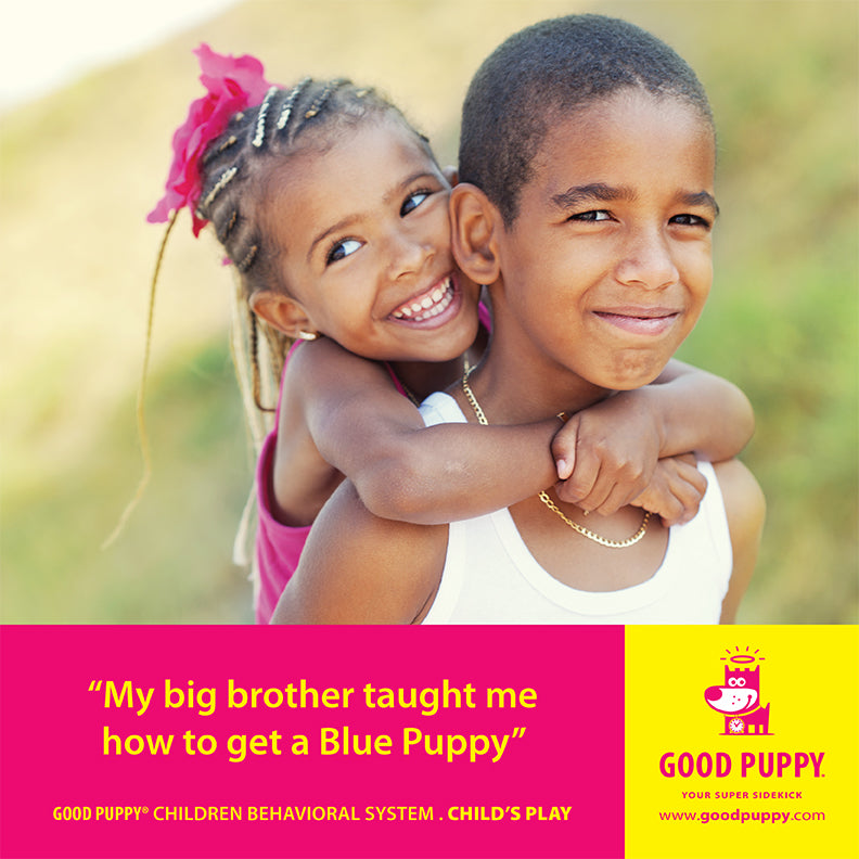 The image shows a young girl hugging her older brother from behind, both smiling happily. Below the image, a yellow and pink section features the text: "My big brother taught me how to get a Blue Puppy." It also mentions "GOOD PUPPY® CHILDREN BEHAVIORAL SYSTEM. CHILD'S PLAY" and provides the website "www.goodpuppy.com." The Good Puppy logo and character are displayed on the right side.