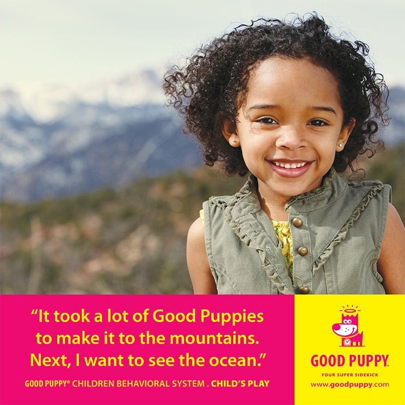 The image shows a smiling young girl standing outdoors with mountains in the background. Below the image, a yellow and pink section features the text: "It took a lot of Good Puppies to make it to the mountains. Next, I want to see the ocean." It also mentions "GOOD PUPPY® CHILDREN BEHAVIORAL SYSTEM. CHILD'S PLAY" and provides the website "www.goodpuppy.com." The Good Puppy logo and character are displayed on the right side.