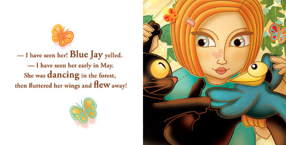 The image is a two-page spread from a book. The left page has a white background with text about the Blue Jay seeing the butterfly in May. The right page shows the girl holding her black cat Mao and a blue jay. They are in a garden with green vines and butterflies, with the girl looking at the bird intently.