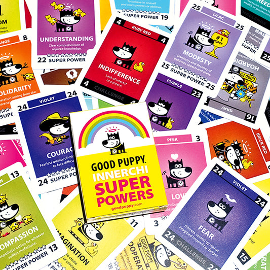 The image displays a collection of colorful "Good Puppy Innerchi Super Powers" cards scattered around a central box. Each card features a cartoon puppy representing different emotions or traits such as understanding, indifference, modesty, courage, compassion, and fear. The cards are designed to help children learn about and manage their emotions through playful illustrations and descriptions, promoting emotional and behavioral development.