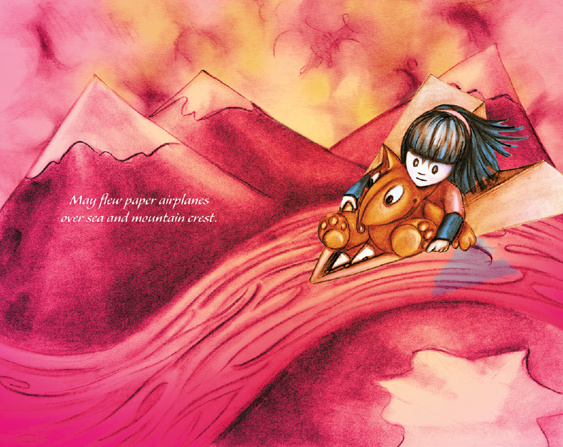 The image shows May flying on a large paper airplane with her stuffed animal, Flynn, through a landscape of pink mountains and rivers. The sky is a blend of pink, yellow, and orange hues. The text reads, "May flew paper airplanes over sea and mountain crest."